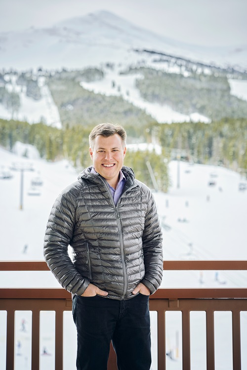 Rob Katz posing in front of ski trails